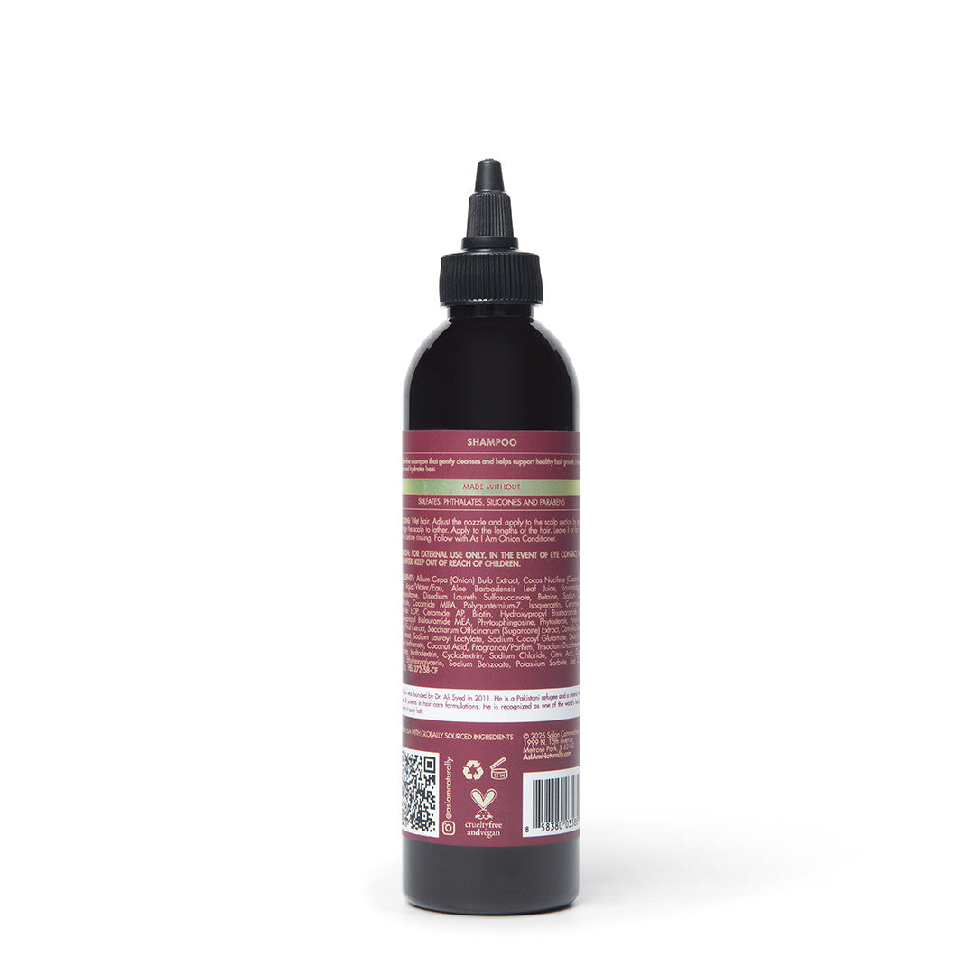 زجاجة شامبو سوداء مع ملصق أحمر على خلفية بيضاء